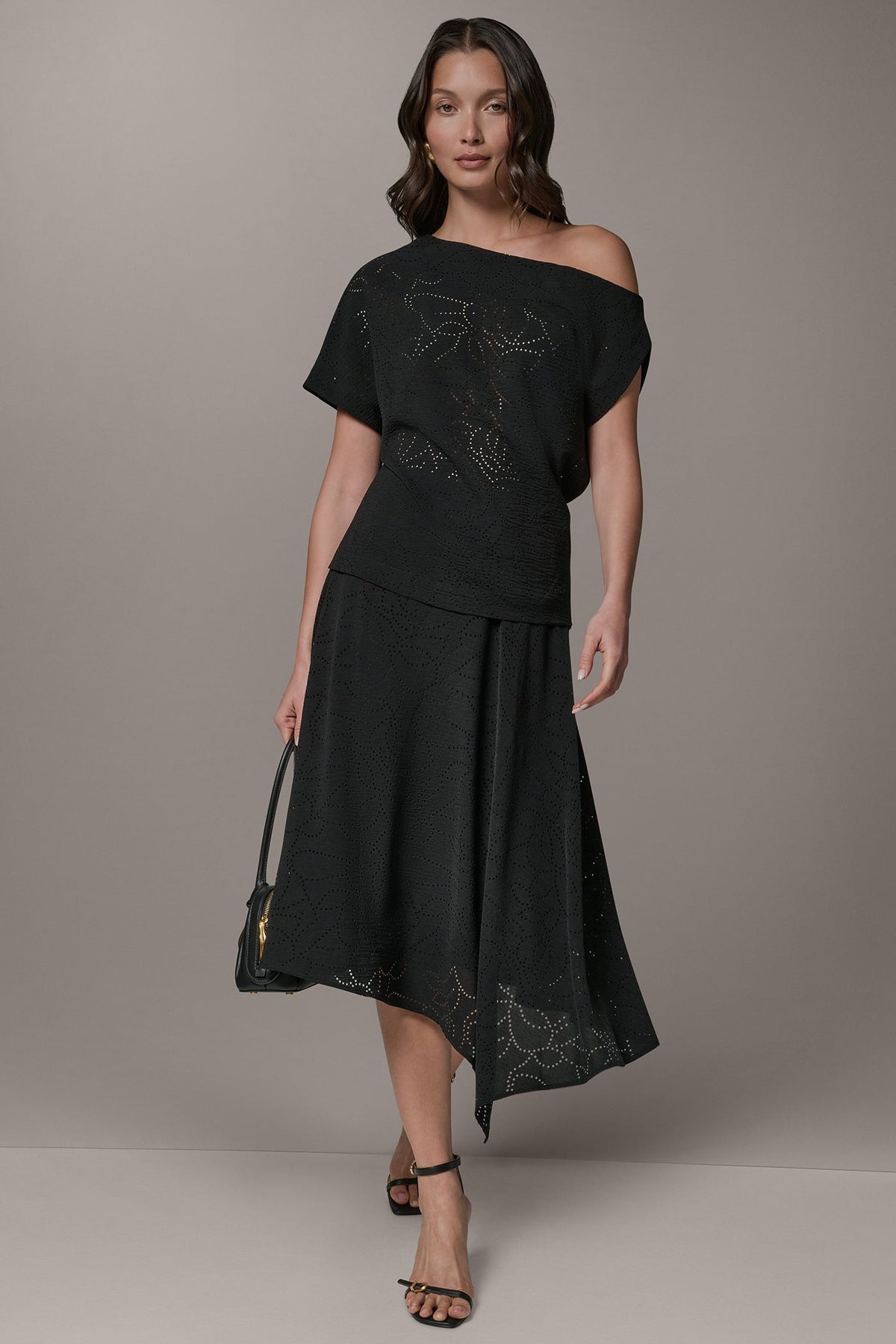 SLEEVELESS ASYMMETRIC LASER CUT TOP