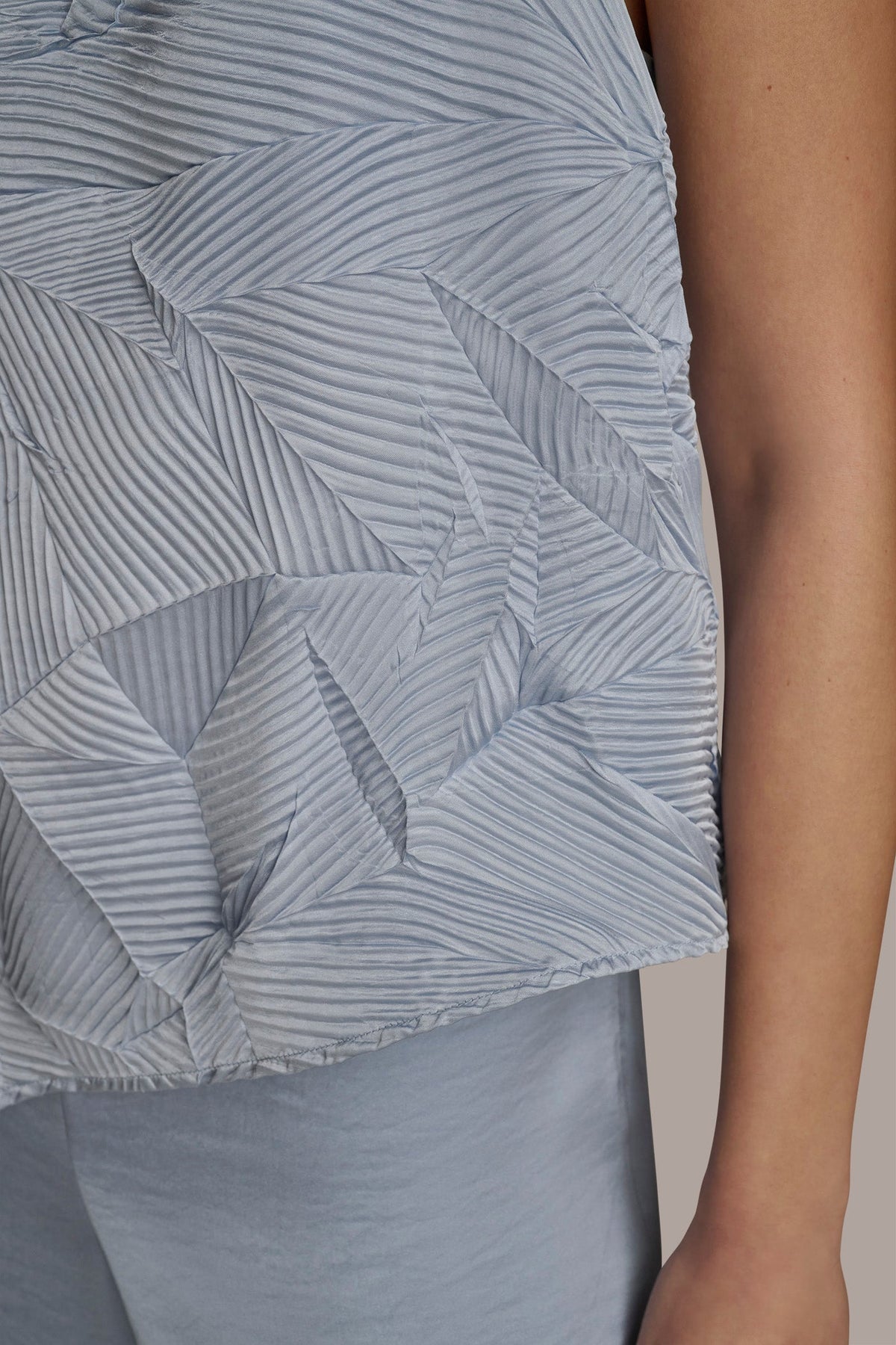TEXTURED TOP WITH ANGLED HEM