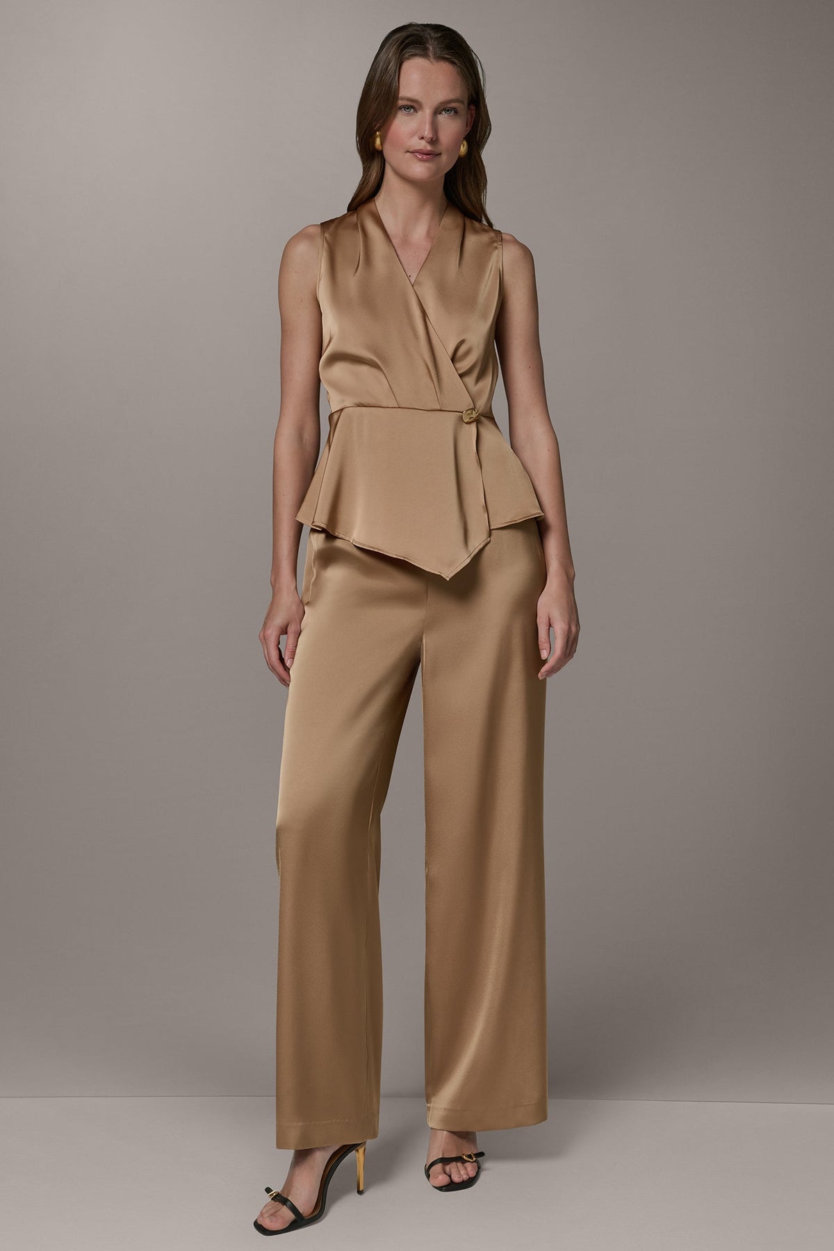 SLEEVELESS WRAP-EFFECT ASYMMETRIC PEPLUM BLOUSE